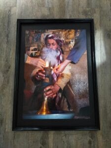 Afghan chillum smoking - framed poster in a black frame.