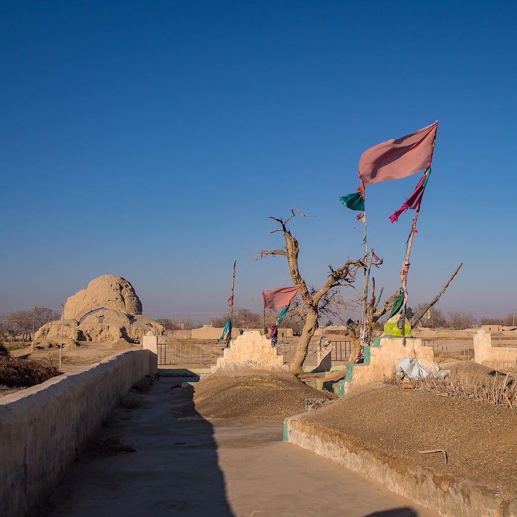 Graves in the city of Balkh with Rum's school in the background.