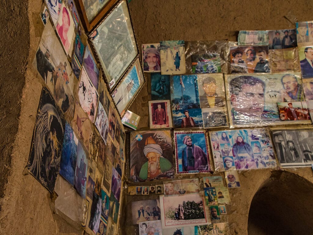 Portraits and poster including Massoud and Rumi, in an afghan chillum house.